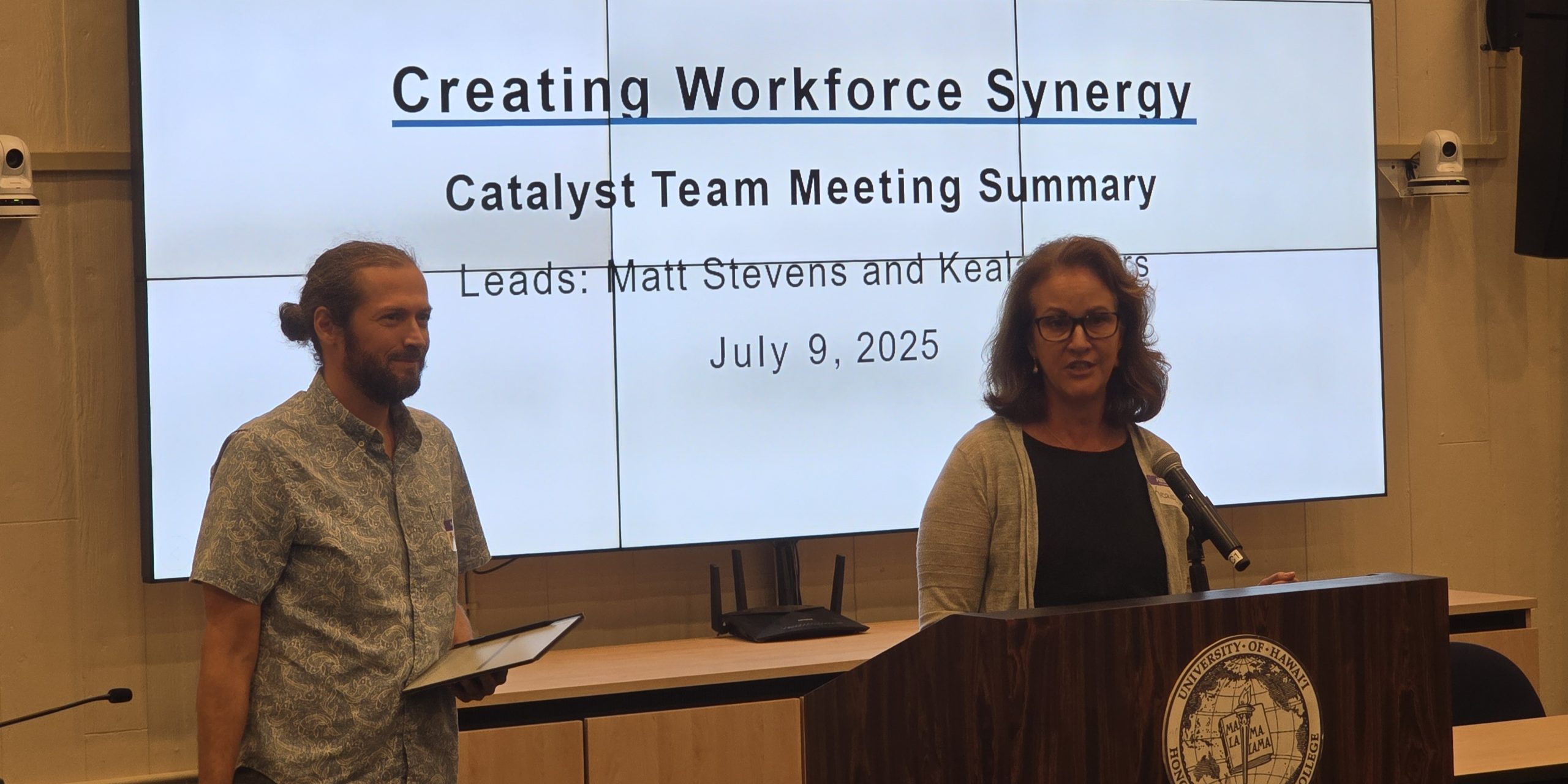 Interactive breakout session during Synergy Summit II with participants engaged in collaborative discussions